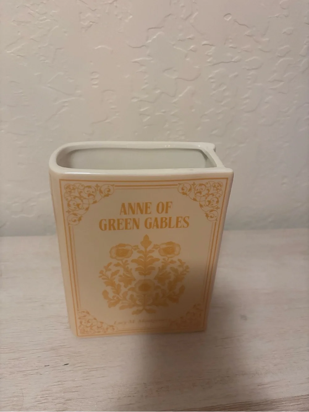 Anne of Green Gables book vase. ceramic book vase with vertical ribbed texture.